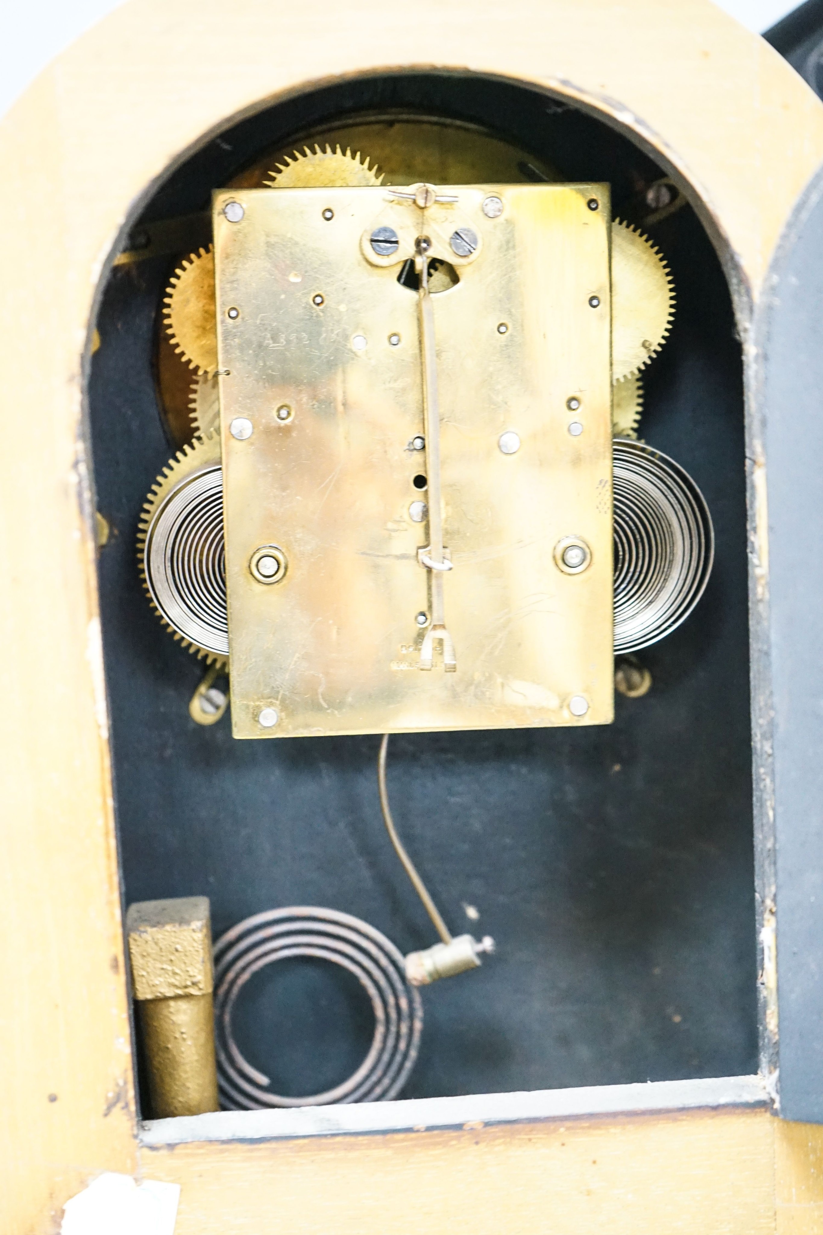 A Victorian slate clock and a 1930's arched clock